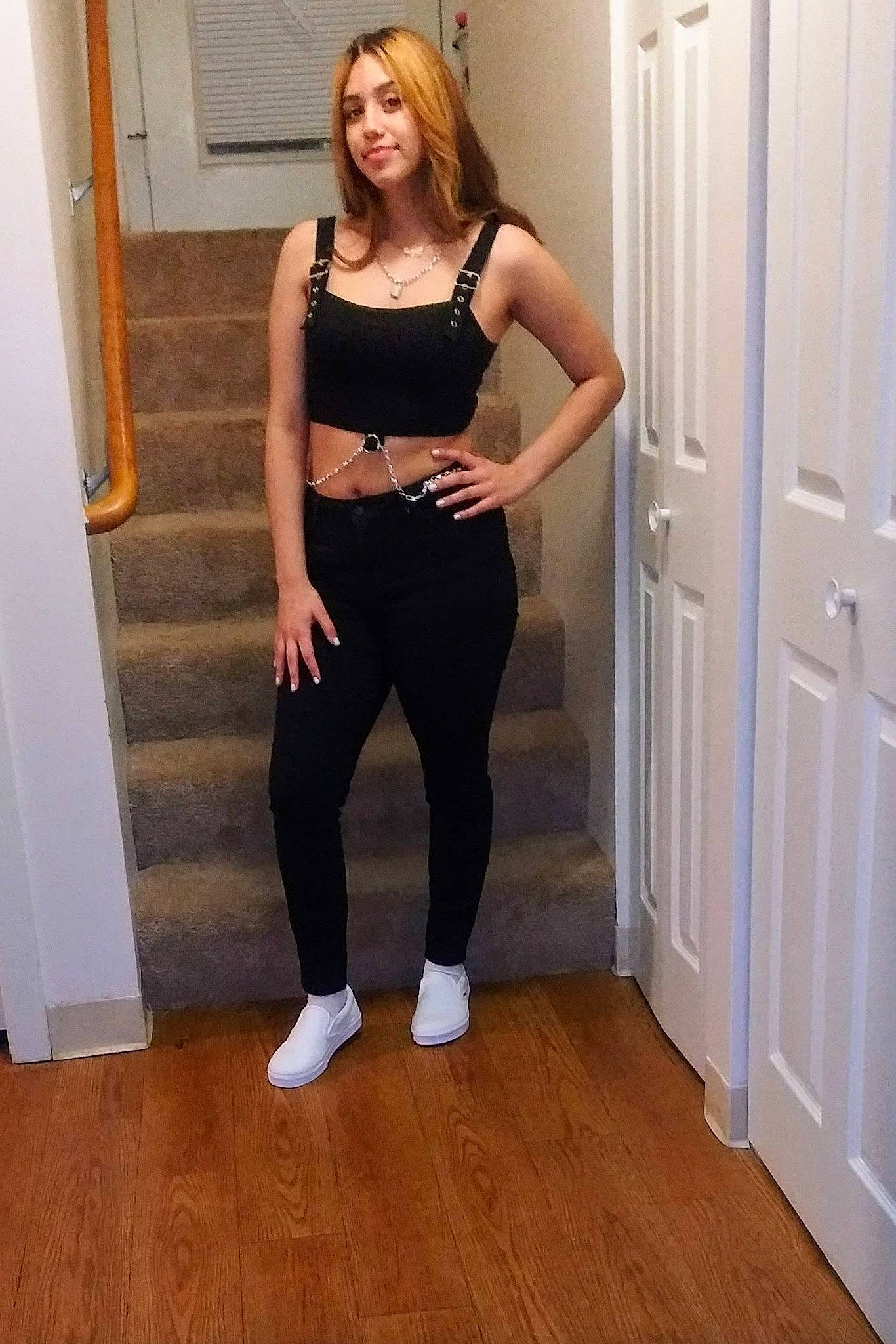 Sarai is registered to the contest to win money with this photo: abdomen, active_pants, chest, door, elbow, floor, flooring, hardwood, human_leg, joy, knee, long_hair, person, sleeve, sportswear, stomach, sunglasses, thigh, trunk, waist