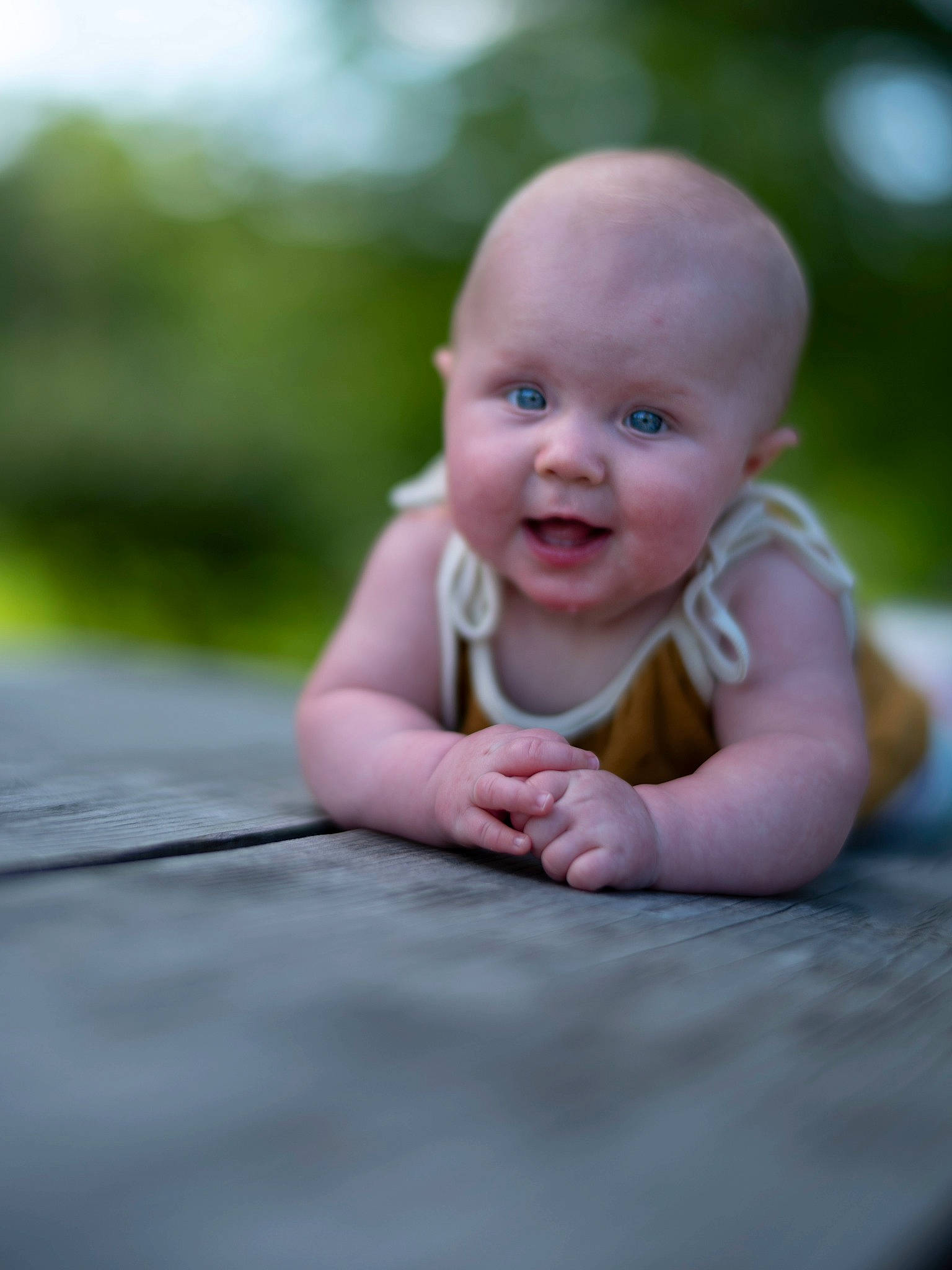 Charlize is registered to the contest to win money with this photo: baby, baby_toddler_clothing, cheek, child, flash_photography, flooring, fun, grass, happy, iris, laugh, leisure, people_in_nature, person, pink, portrait_photography, sitting, skin, smile, toddler