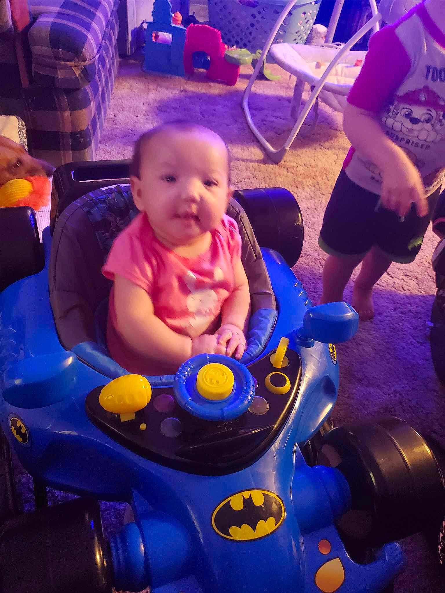 Isabella is registered to the contest to win money with this photo: automotive_design, baby, baby_products, blue, chair, child, cloud, cool, electric_blue, fun, happy, lap, leisure, light, people, person, purple, recreation, snapshot, toddler