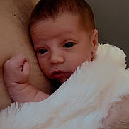 Lorenzo joined the competition — help win amazing prizes! baby, infant, newborn, blanket, fur_blanket, arm, chest, skin, person, human, closeup, portrait, cuddle, holding, love, tenderness, resting, indoor, warmth, comfort