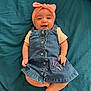 Keïssy participe au concours pour gagner de l'argent avec cette photo : baby, infant, smile, denim_dress, headband, pink, butterfly, clothing, happy, lying_down, blanket, cute, child, skin, foot, hand, portrait, indoors, person, fashion