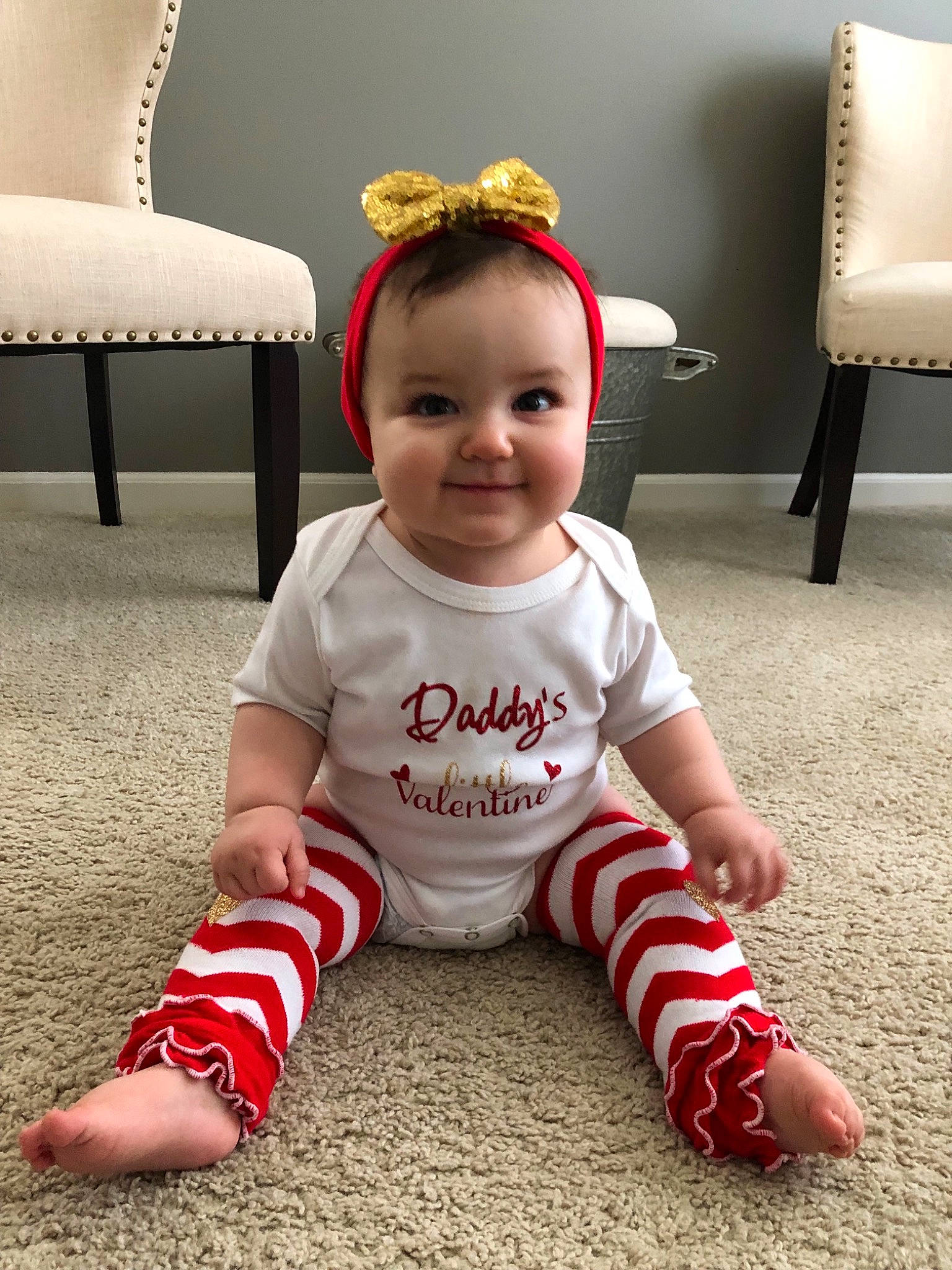 Lilyana is registered to the contest to win money with this photo: baby, baby_toddler_clothing, child, christmas, crawling, face, floor, flooring, footwear, head, joy, leg, person, product, shoe, sitting, skin, sleeve, smile, t_shirt