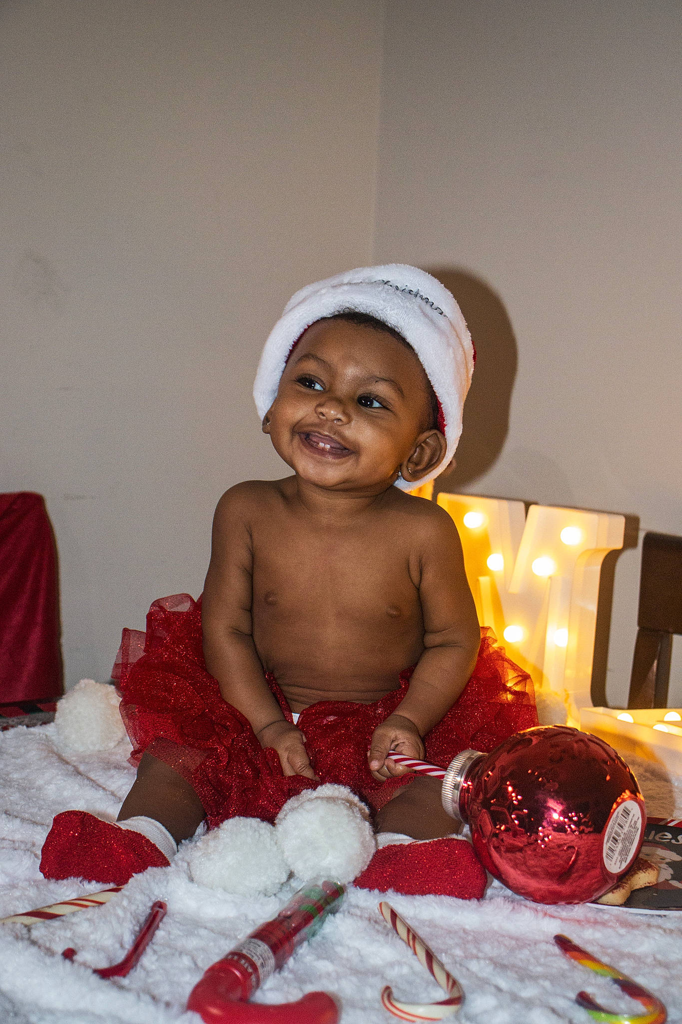Brookekenedii is registered to the contest to win money with this photo: baby, baby_toddler_clothing, cap, carmine, child, christmas, christmas_eve, comfort, event, face, flash_photography, fun, happy, holiday, laugh, person, portrait_photography, room, sitting, smile