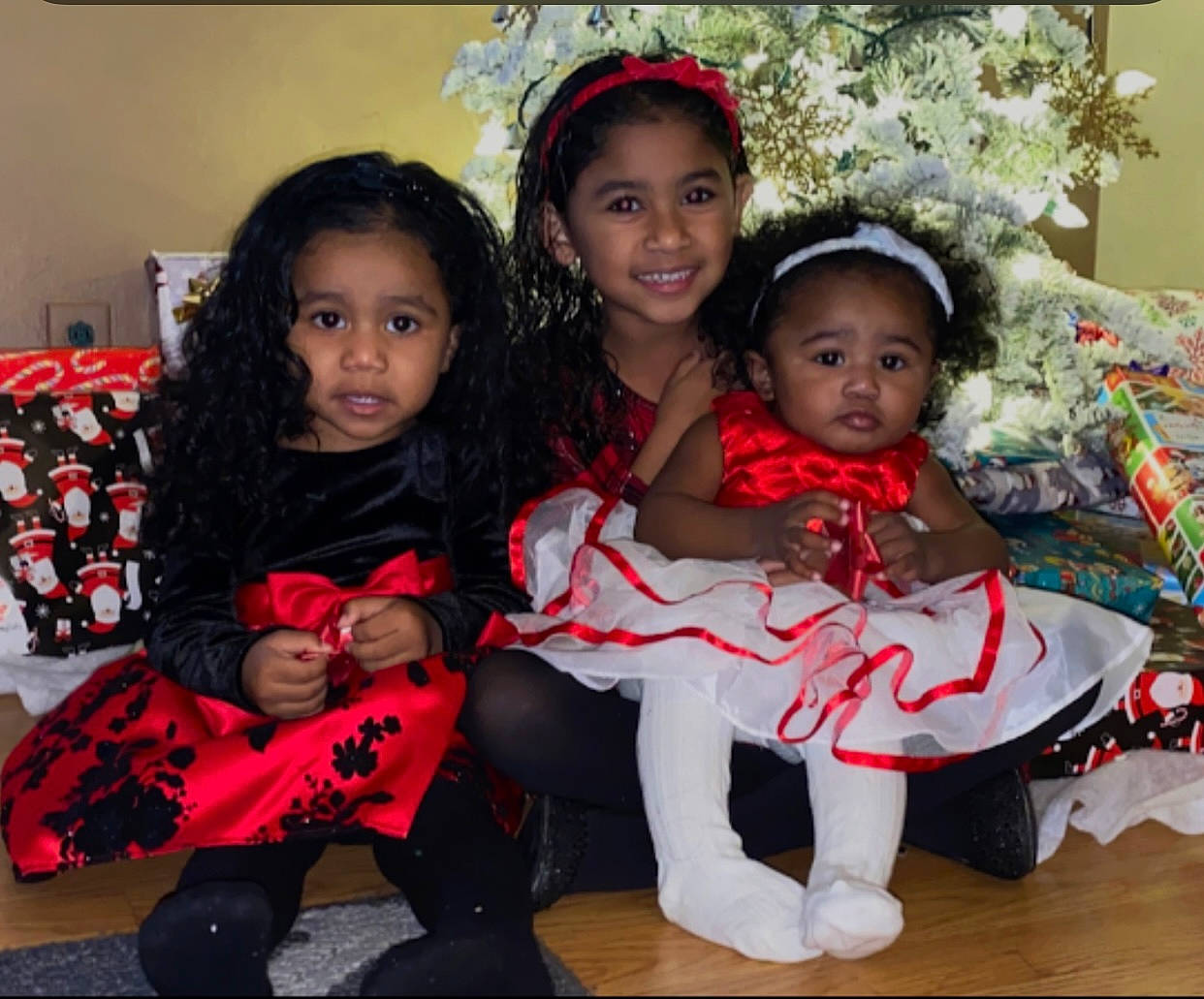 Zaylah joined the competition — help win amazing prizes! baby_toddler_clothing, carmine, child, christmas, christmas_decoration, christmas_eve, christmas_ornament, event, facial_expression, fun, happy, headwear, holiday, joy, lap, party, person, red, smile, t_shirt