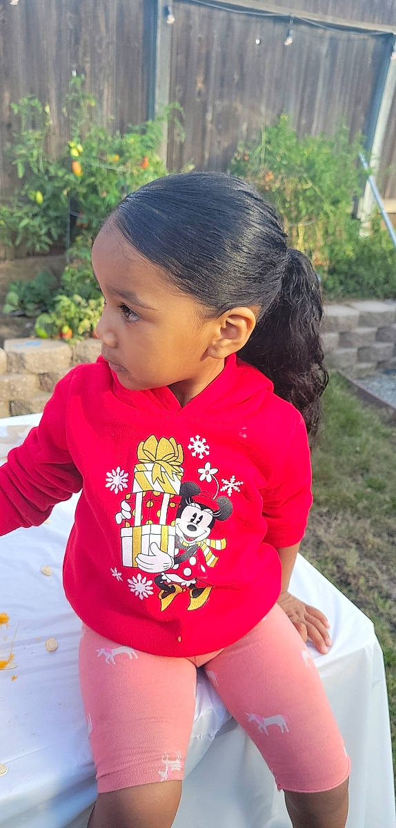 Zaylah joined the competition — help win amazing prizes! baby, baby_toddler_clothing, black_hair, child, eye, face, grass, hair, hairstyle, happy, head, leg, leisure, neck, person, plant, skin, sleeve, thigh, toddler