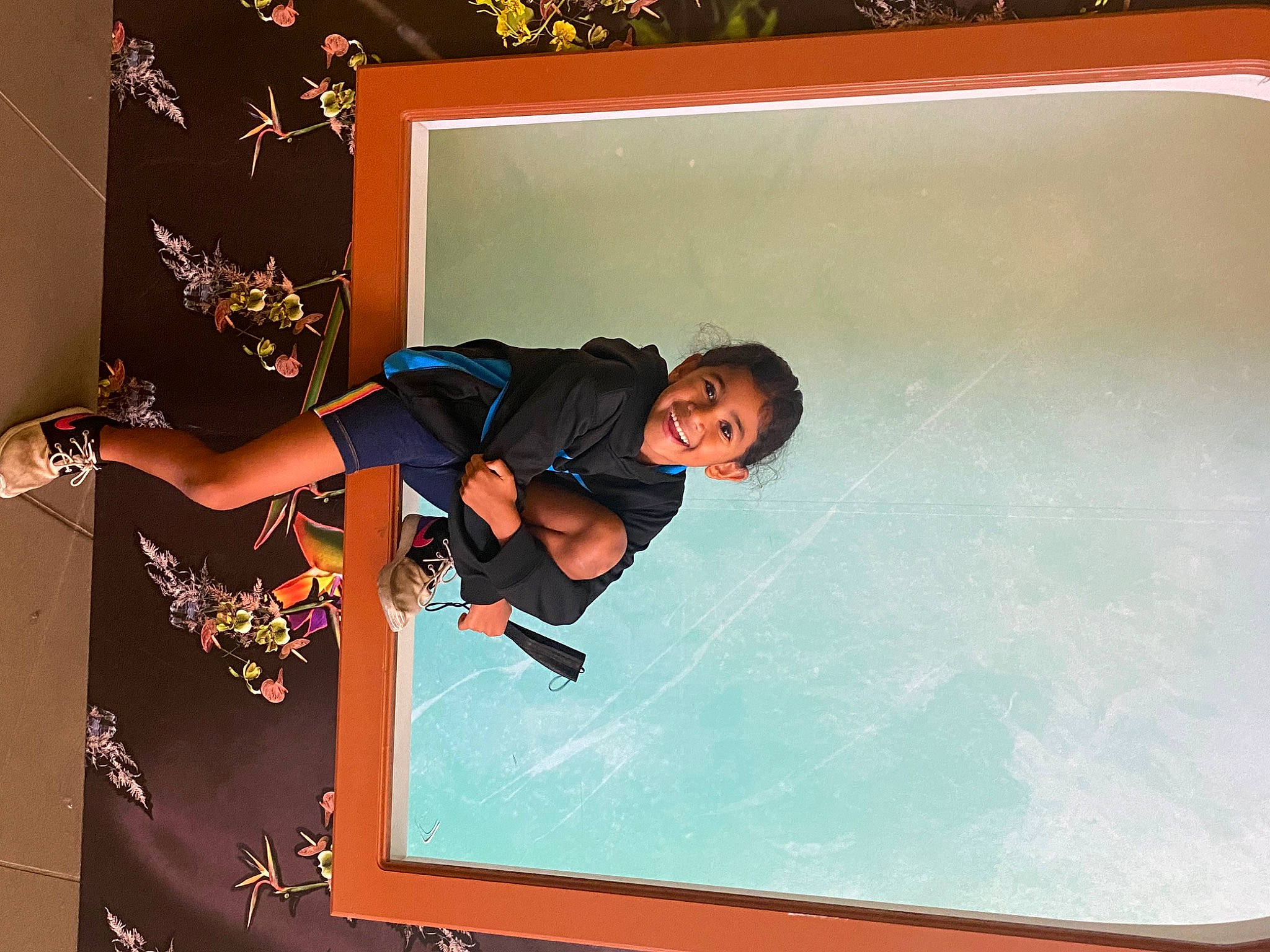 Aniyah is registered to the contest to win money with this photo: art, artist, elbow, flooring, font, fun, graphics, happy, indoor_games_and_sports, joy, knee, leisure, person, play, recreation, rectangle, room, smile, sportswear, sunglasses