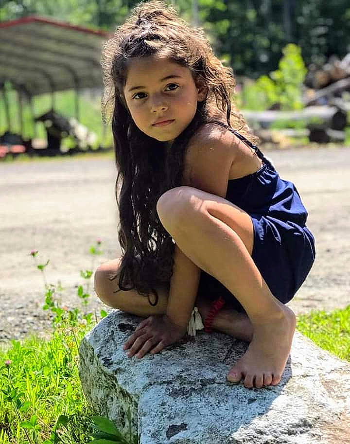 Zahra is registered to the contest to win money with this photo: beauty, black_hair, fawn, grass, lady, leg, long_hair, model, person, photo_shoot, photograph, photography, sitting, smile, thigh