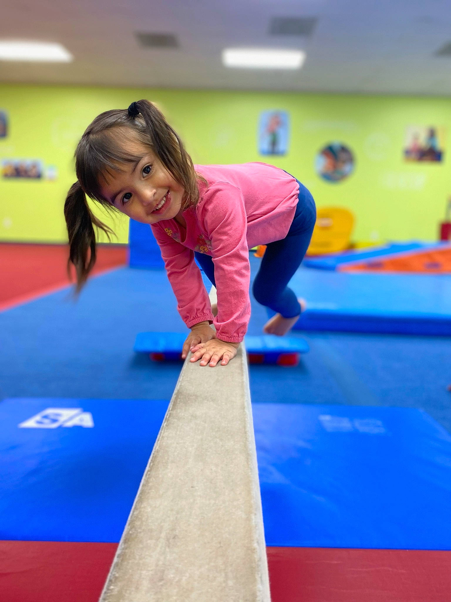 Ava Lee is registered to the contest to win money with this photo: balance, child, competition, competition_event, elbow, electric_blue, floor, flooring, fun, indoor_games_and_sports, joint, joy, knee, leisure, person, physical_fitness, recreation, room, sports, sportswear