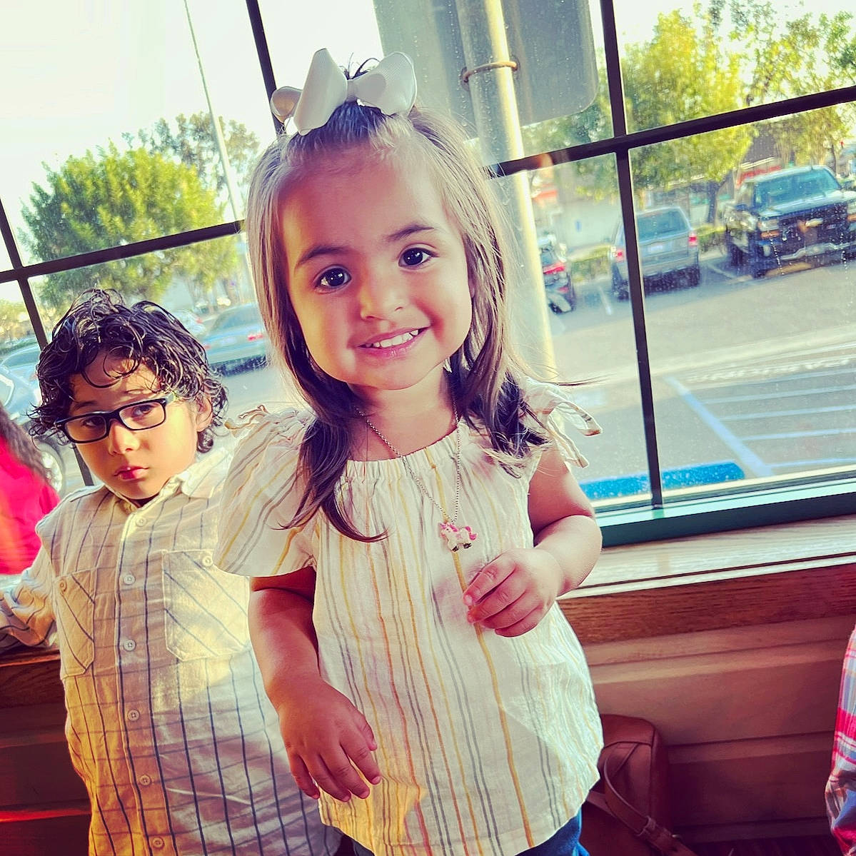 Ava Lee is registered to the contest to win money with this photo: cool, eyewear, facial_expression, finger, fun, gesture, hand, happy, joy, leisure, morning, person, shoulder, skin, sleeve, smile, standing, summer, sunlight, toddler