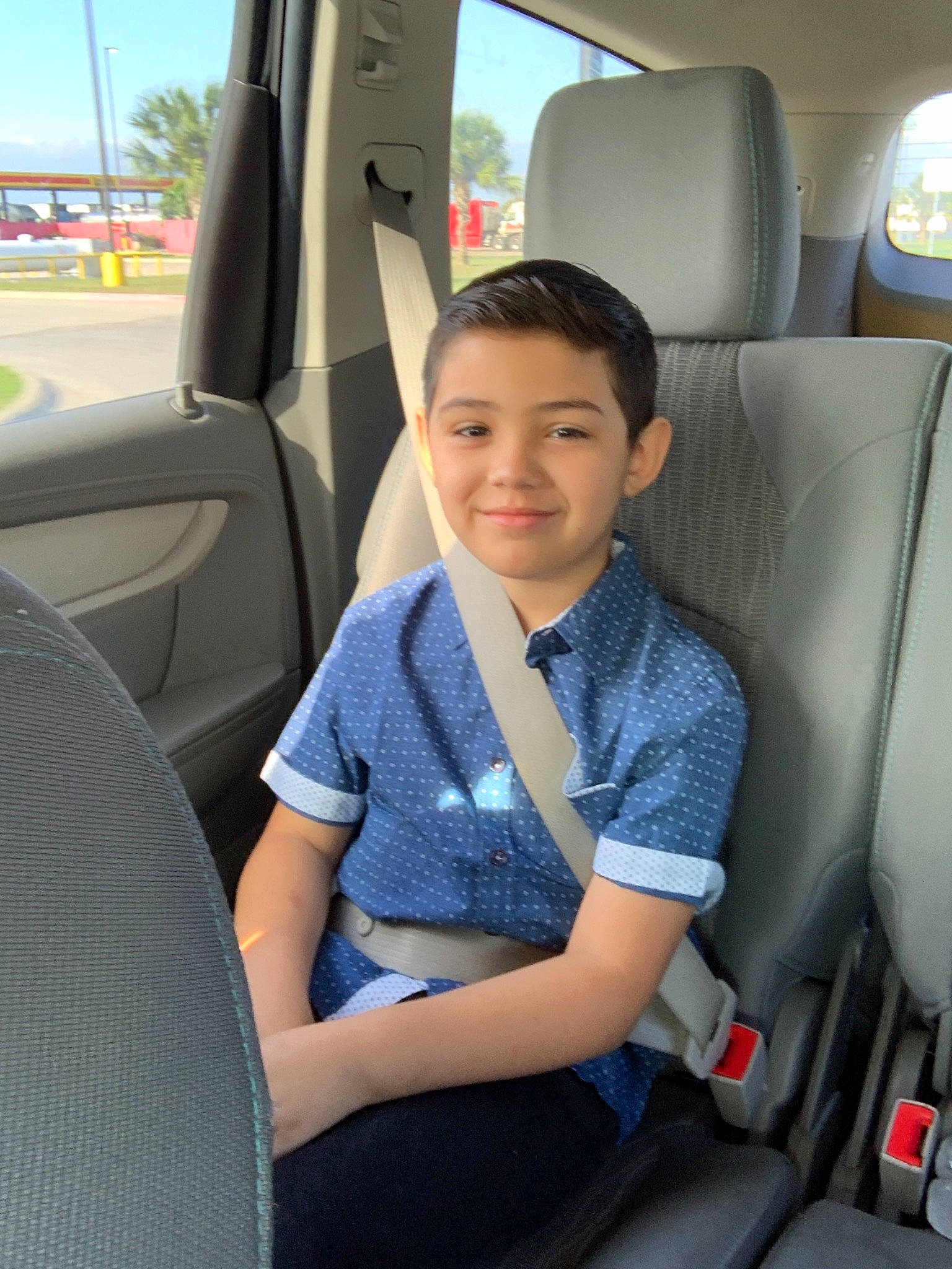 Dominic is registered to the contest to win money with this photo: auto_part, car, car_seat, car_seat_cover, family_car, head_restraint, joy, passenger, person, seat_belt, vehicle