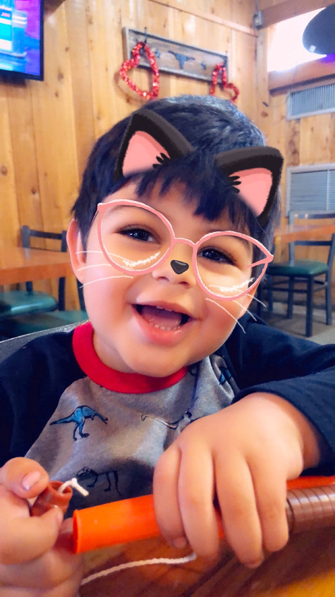 Evan is registered to the contest to win money with this photo: child, face, finger, fun, gesture, glasses, hand, joy, nose, person, smile, thumb, toddler, vacation