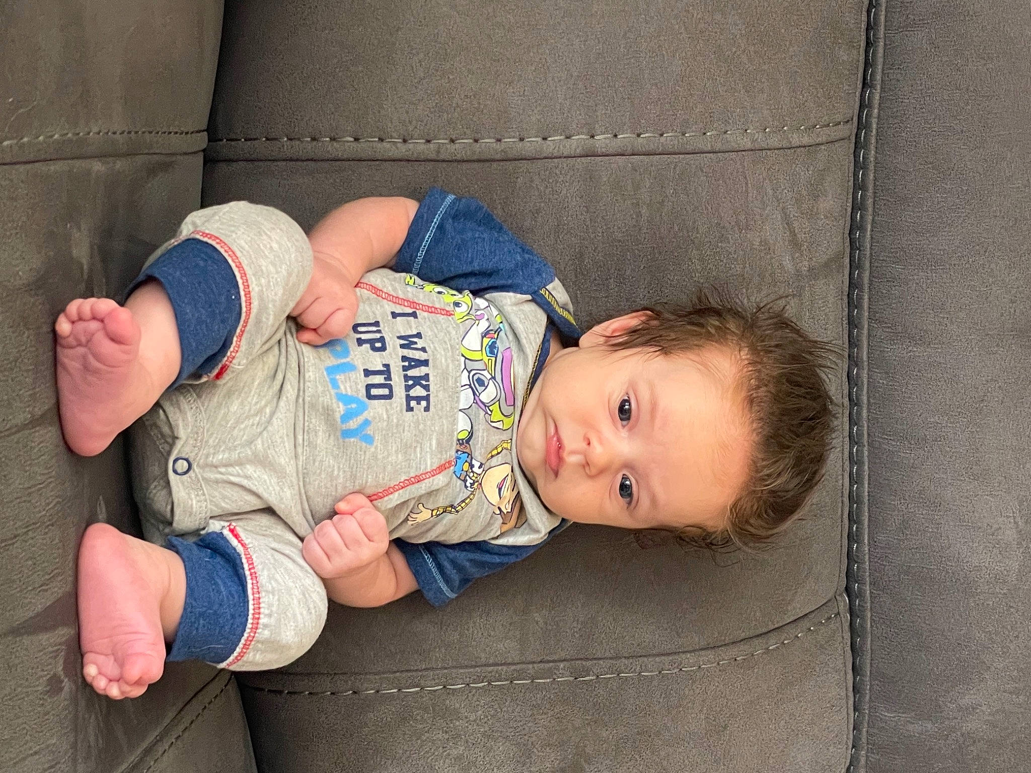Joey is registered to the contest to win money with this photo: baby, baby_products, baby_toddler_clothing, child, comfort, couch, finger, hand, human, living_room, person, sock, thumb, toddler, wrist