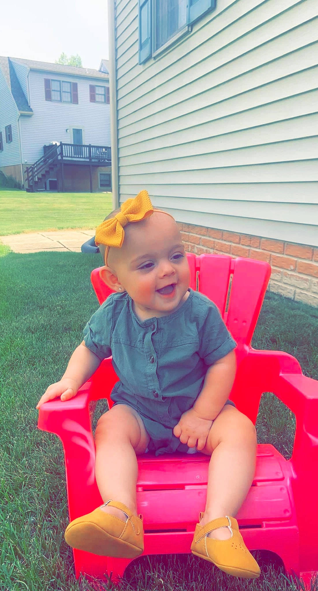 Ava is registered to the contest to win money with this photo: baby_toddler_clothing, electric_blue, eye, fun, grass, happy, hat, lap, leisure, magenta, outdoor_furniture, person, pink, play, recreation, shorts, smile, t_shirt, thigh, toddler