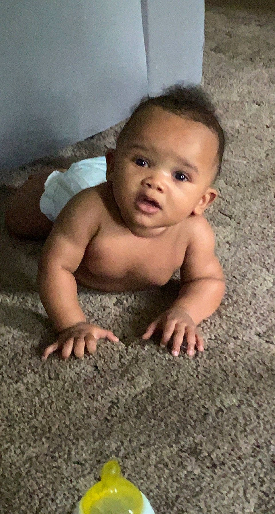 Christian is registered to the contest to win money with this photo: baby, cheek, crawling, eyebrow, finger, flash_photography, floor, flooring, hair, hand, happy, human_body, iris, mouth, nose, person, skin, smile, toddler, vertebrate