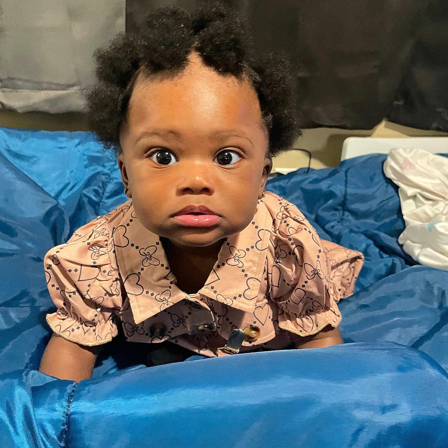 Euriyah is registered to the contest to win money with this photo: architecture, baby, blackhair, blanket, bodypart, building, clothing, crawling, dress, face, finger, hair, happy, head, hospital, person, photography, portrait, sitting, smile