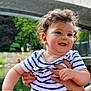 baby, child, curly_hair, striped_shirt, smiling, outdoor, pond, bridge, greenery, hands, person, happy, cute, portrait, nature, water, summer, holding, infant, playful