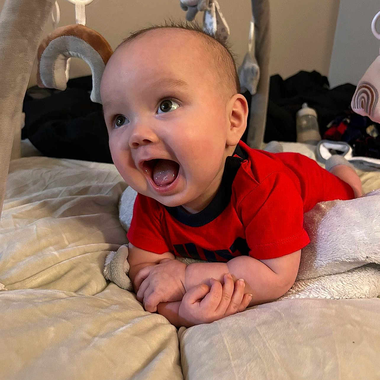 Atreus is registered to the contest to win money with this photo: accessories, architecture, baby, babylaughing, bed, bedroom, bodypart, building, clothing, couch, cradle, crib, cushion, dress, earring, face, furniture, happy, head, homedecor