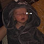 baby, sleeping, towel, hooded_towel, blanket, child, bed, indoor, cozy, cute, soft, resting, person, face, infant, sleep, wrapped, comfort, hood, animal_design