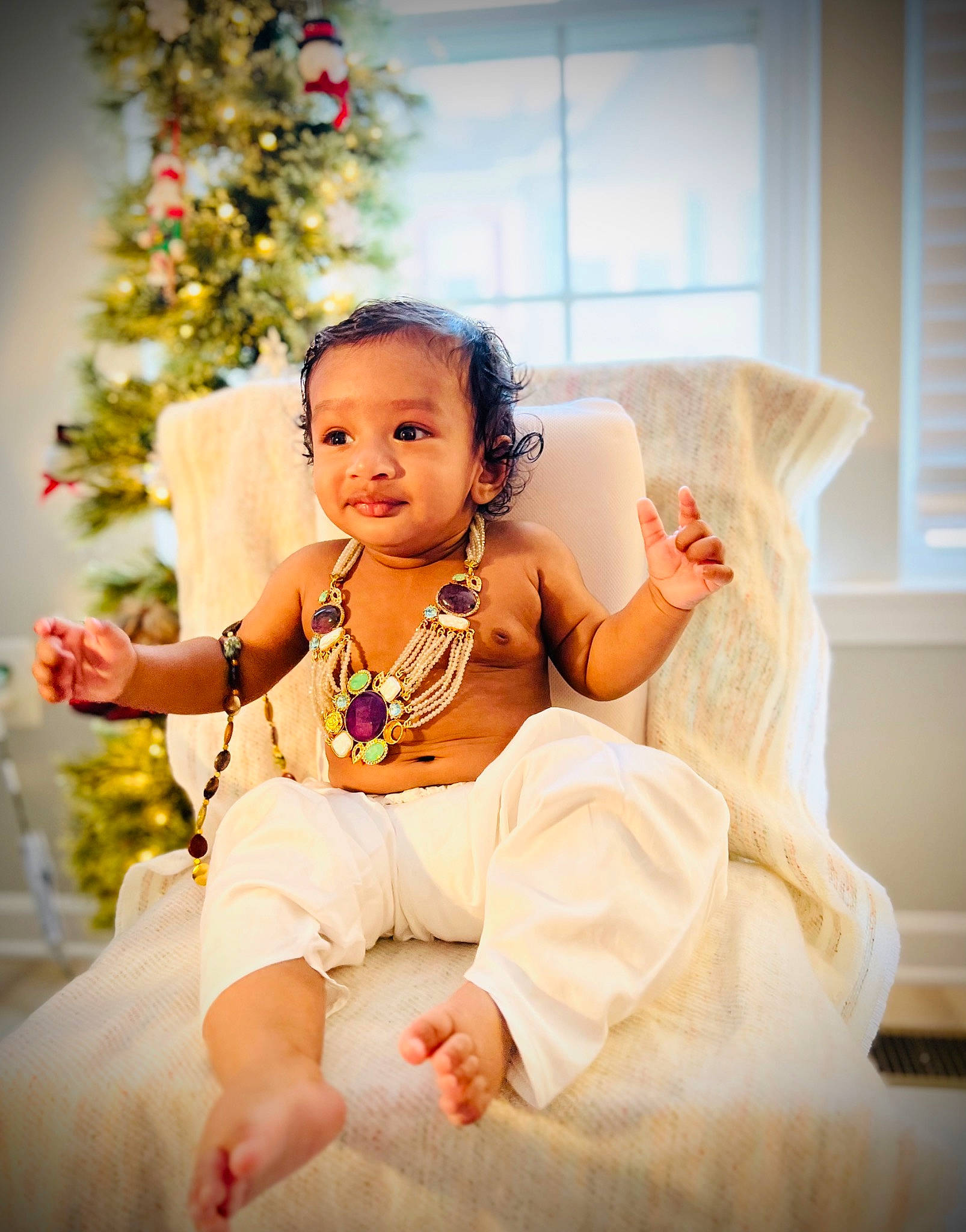 Arhaan joined the competition — help win amazing prizes! baby, baby_toddler_clothing, bridal_clothing, child, christmas_tree, comfort, couch, dress, event, fashion_accessory, fashion_design, flash_photography, happy, headpiece, jewellery, person, sitting, smile, toddler, tradition