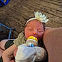 arm, baby, bottle_feeding, closeup, clothing, comfort, cute, feeding, flower, hand, headband, indoor, infant, newborn, person, resting, skin, sleeping, toddler, wooden_floor