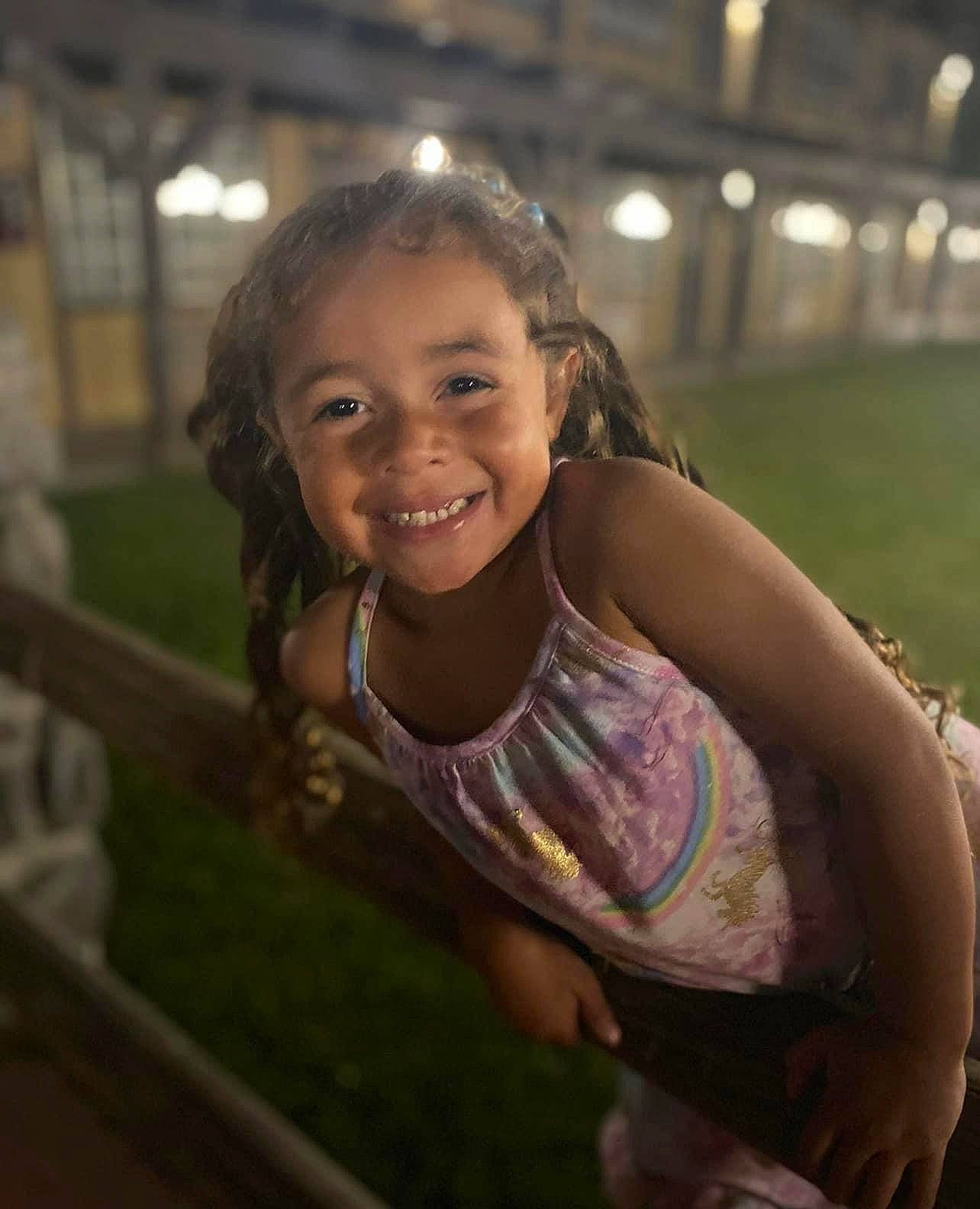 Saraya is registered to the contest to win money with this photo: abdomen, black_hair, chest, child, cool, dress, elbow, eye, face, flash_photography, fun, grass, happy, joy, leisure, long_hair, person, sitting, skin, smile