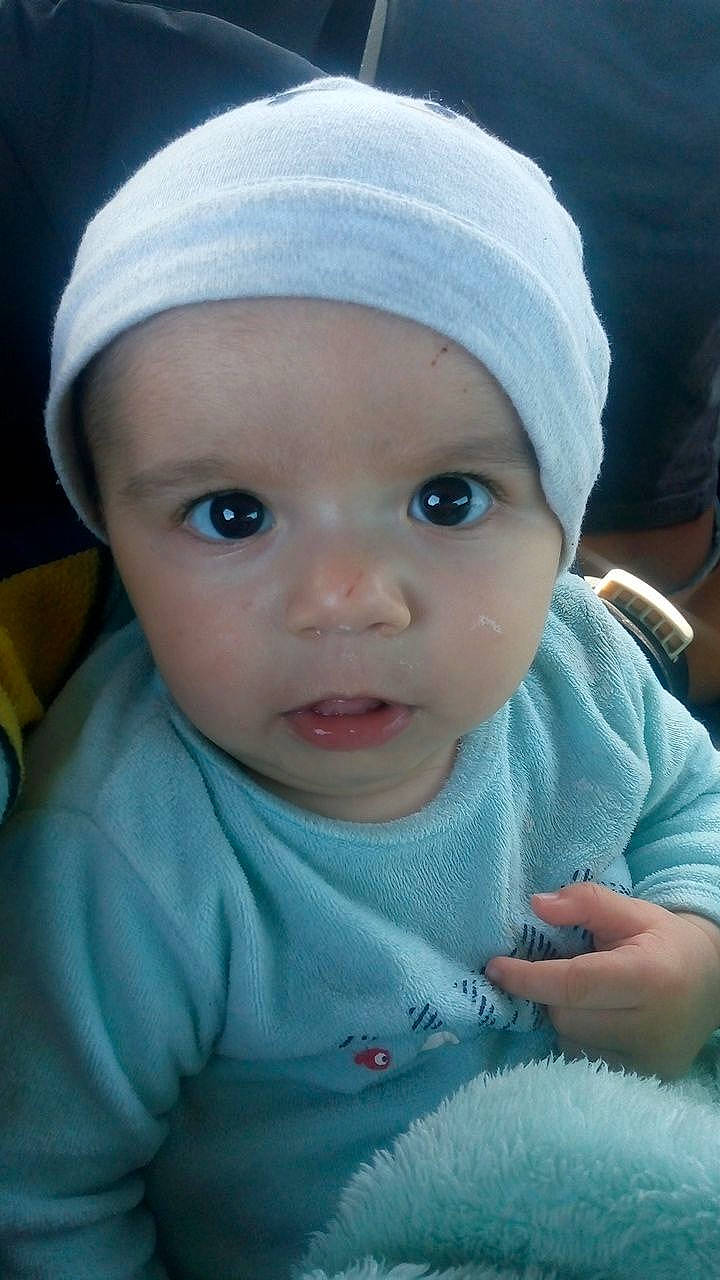 Dévone participe au concours pour gagner de l'argent avec cette photo : azure, baby, baby_toddler_clothing, cap, cheek, child, chin, close_up, comfort, cool, eye, eyebrow, hat, headwear, iris, lip, mouth, nose, person, skin