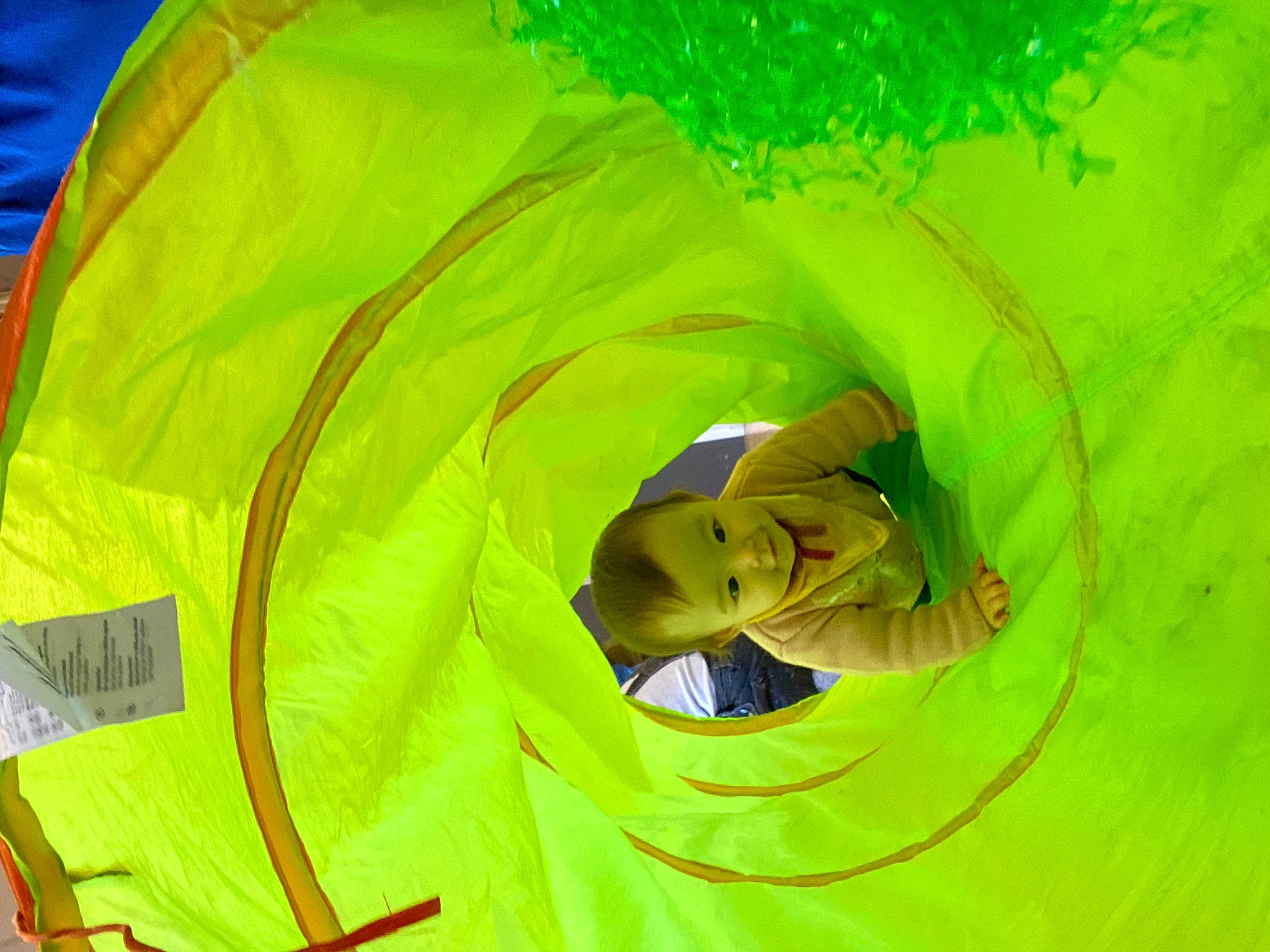 Evie is registered to the contest to win money with this photo: art, child, circle, event, fashion_accessory, fun, graphics, grass, happy, hat, people_in_nature, person, personal_protective_equipment, plant, smile, visual_arts