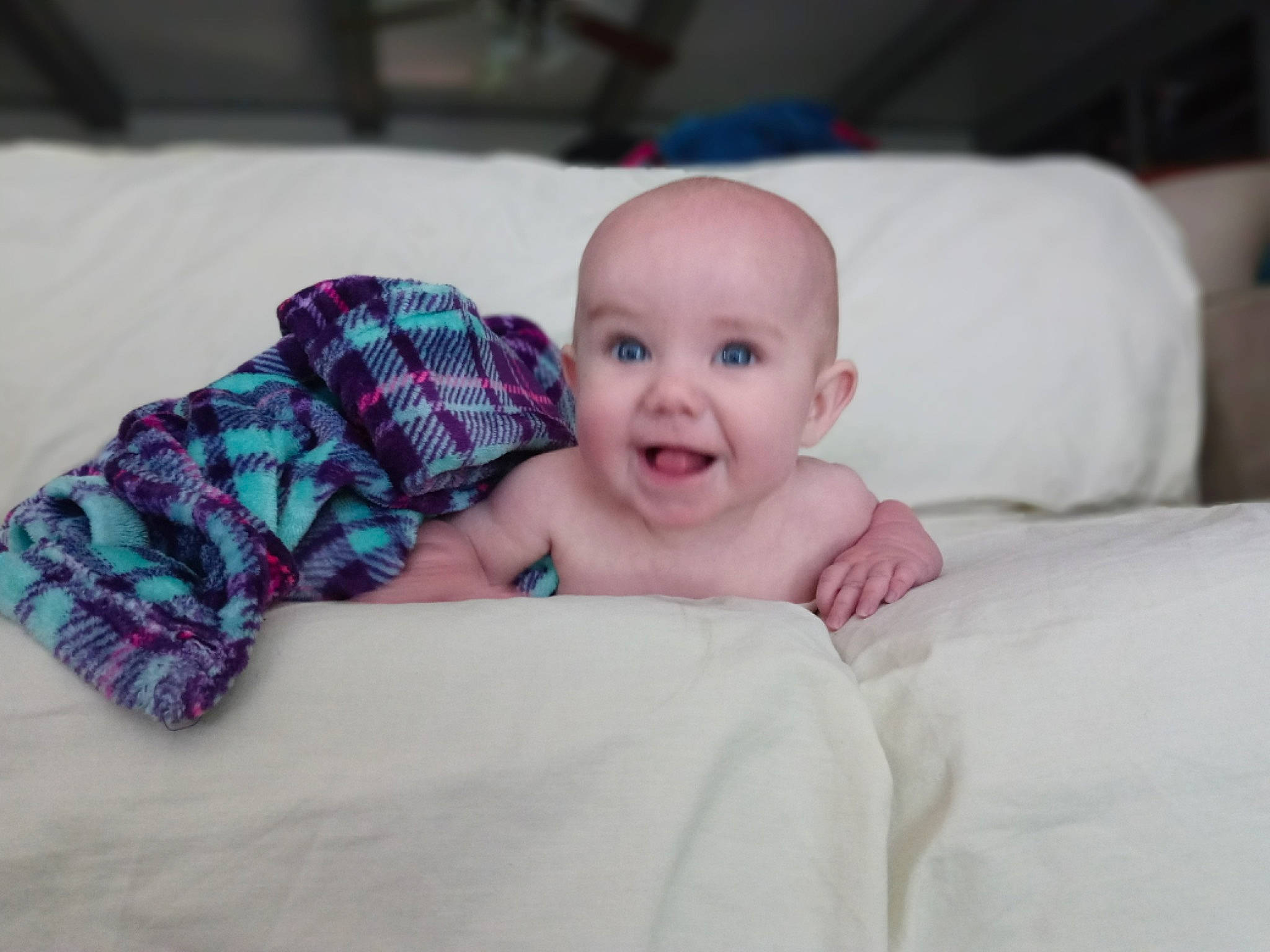 Cassandra joined the competition — help win amazing prizes! baby, baby_toddler_clothing, bedding, cheek, child, comfort, finger, flash_photography, happy, iris, linens, pattern, person, plaid, room, sitting, skin, smile, tartan, textile