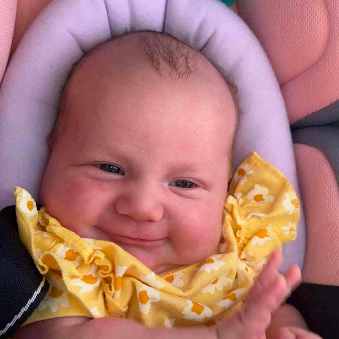 Chayanna joined the competition — help win amazing prizes! baby, car_seat, child, comfort, cute, expression, face, hand, happy, infant, pink, plush, portrait, seat_belt, sitting, skin, smile, wearing, yellow_clothing, young