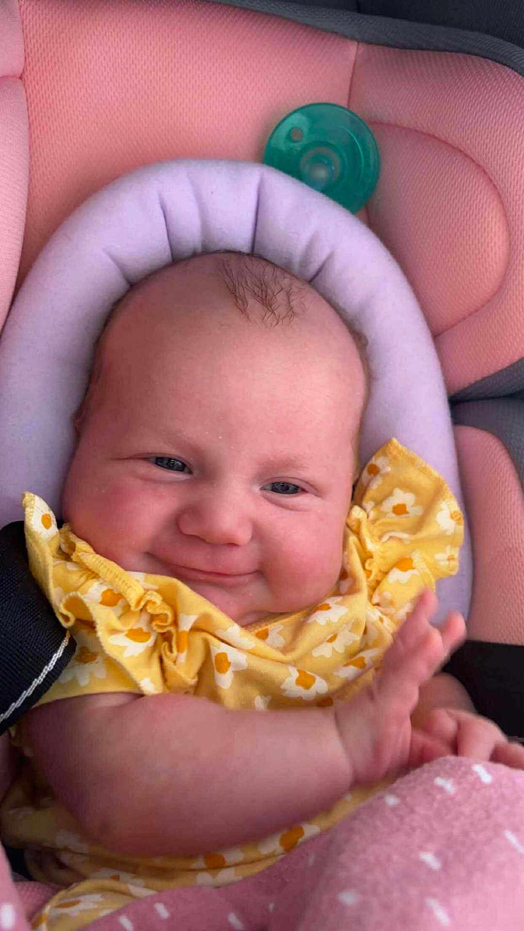 Chayanna joined the competition — help win amazing prizes! baby, infant, smile, yellow_clothing, car_seat, pink, cute, child, face, hand, happy, portrait, wearing, seat_belt, plush, comfort, young, skin, expression, sitting