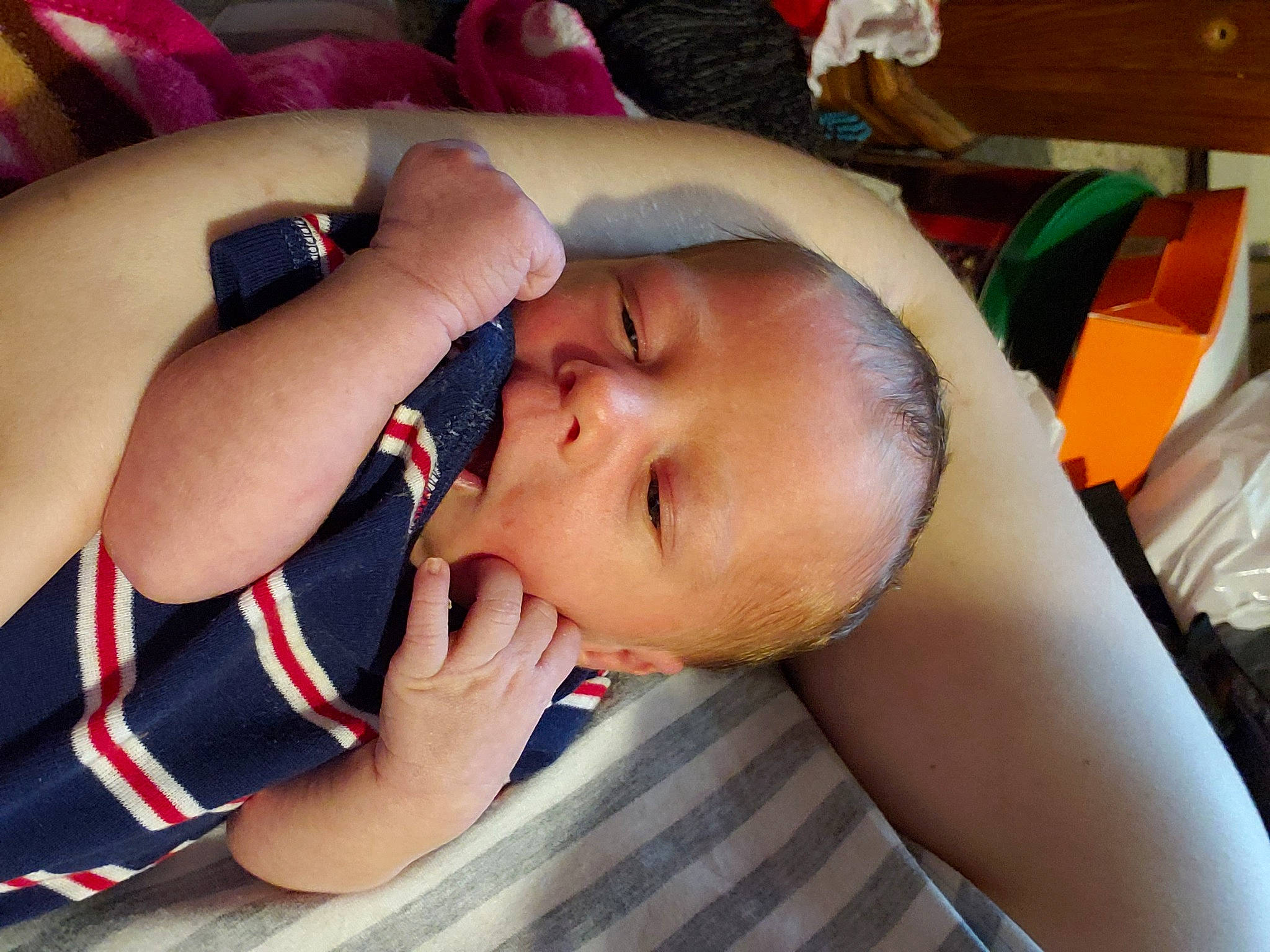 Levi is registered to the contest to win money with this photo: arm, baby, black_hair, cheek, chest, comfort, ear, elbow, eyebrow, eyelash, finger, fun, gesture, happy, lip, mouth, neck, nose, person, skin