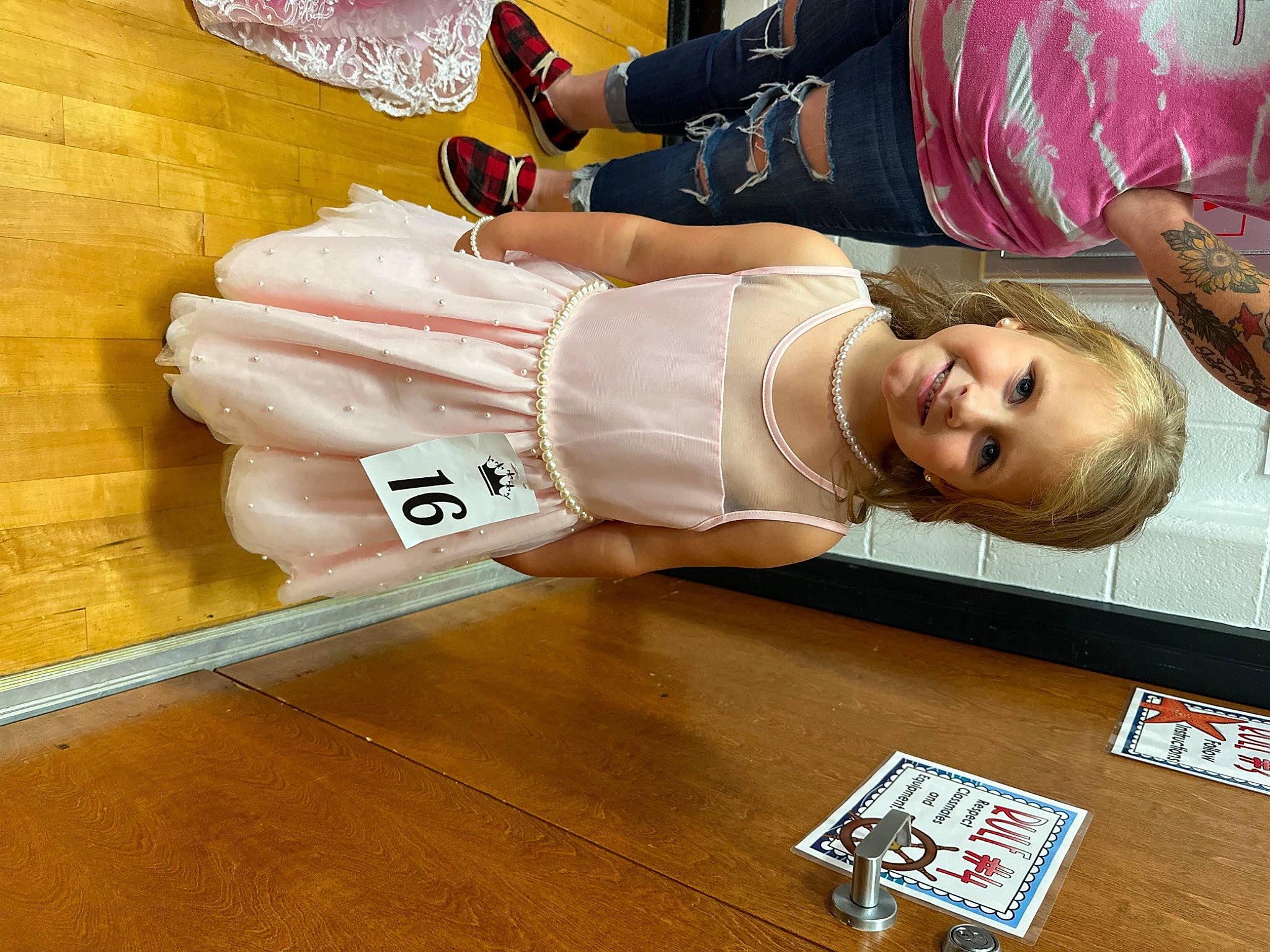 Maggie joined the competition — help win amazing prizes! abdomen, advertising, child, costume, elbow, flesh, flooring, fun, happy, hardwood, human_leg, japanese_idol, joy, knee, person, room, smile, sportswear, table, thigh