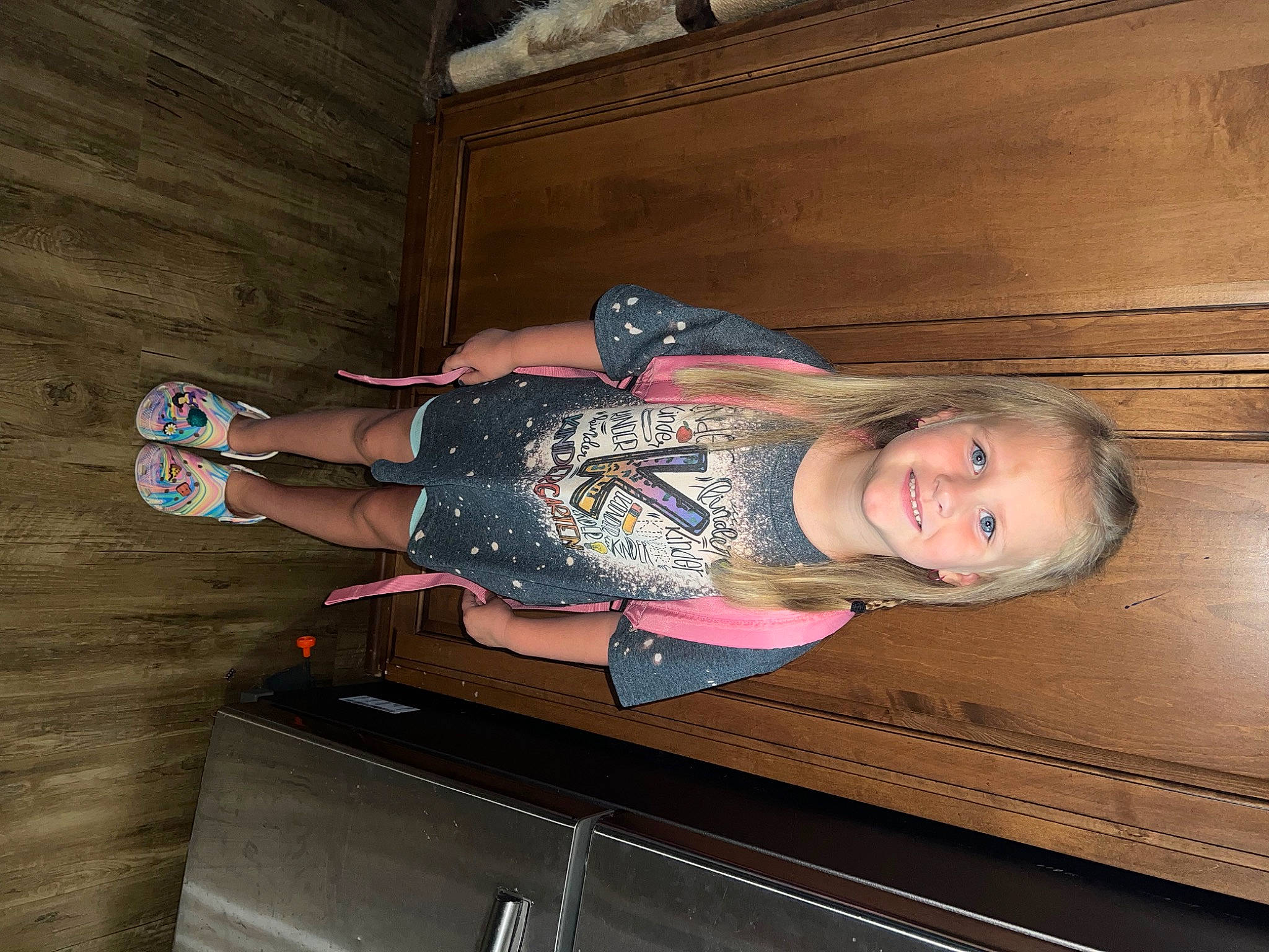 Maggie is registered to the contest to win money with this photo: baby_toddler_clothing, child, comfort, floor, flooring, foot, fun, hardwood, human_leg, joy, leg, person, room, smile, thigh, toddler, varnish, walking_shoe, wood, wood_stain