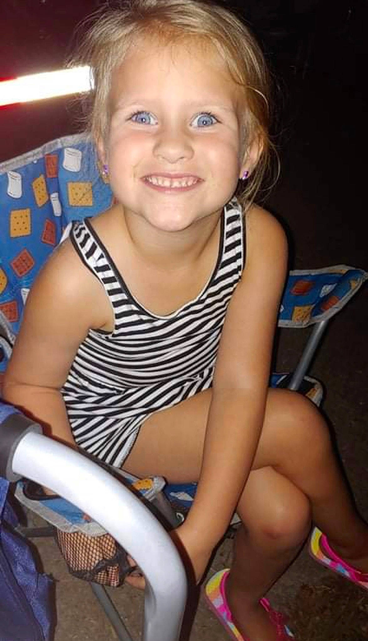 Maggie is registered to the contest to win money with this photo: arm, baby_toddler_clothing, chair, cheek, cool, facial_expression, finger, fun, hairstyle, happy, iris, joy, lap, lip, mouth, organ, people, person, skin, smile