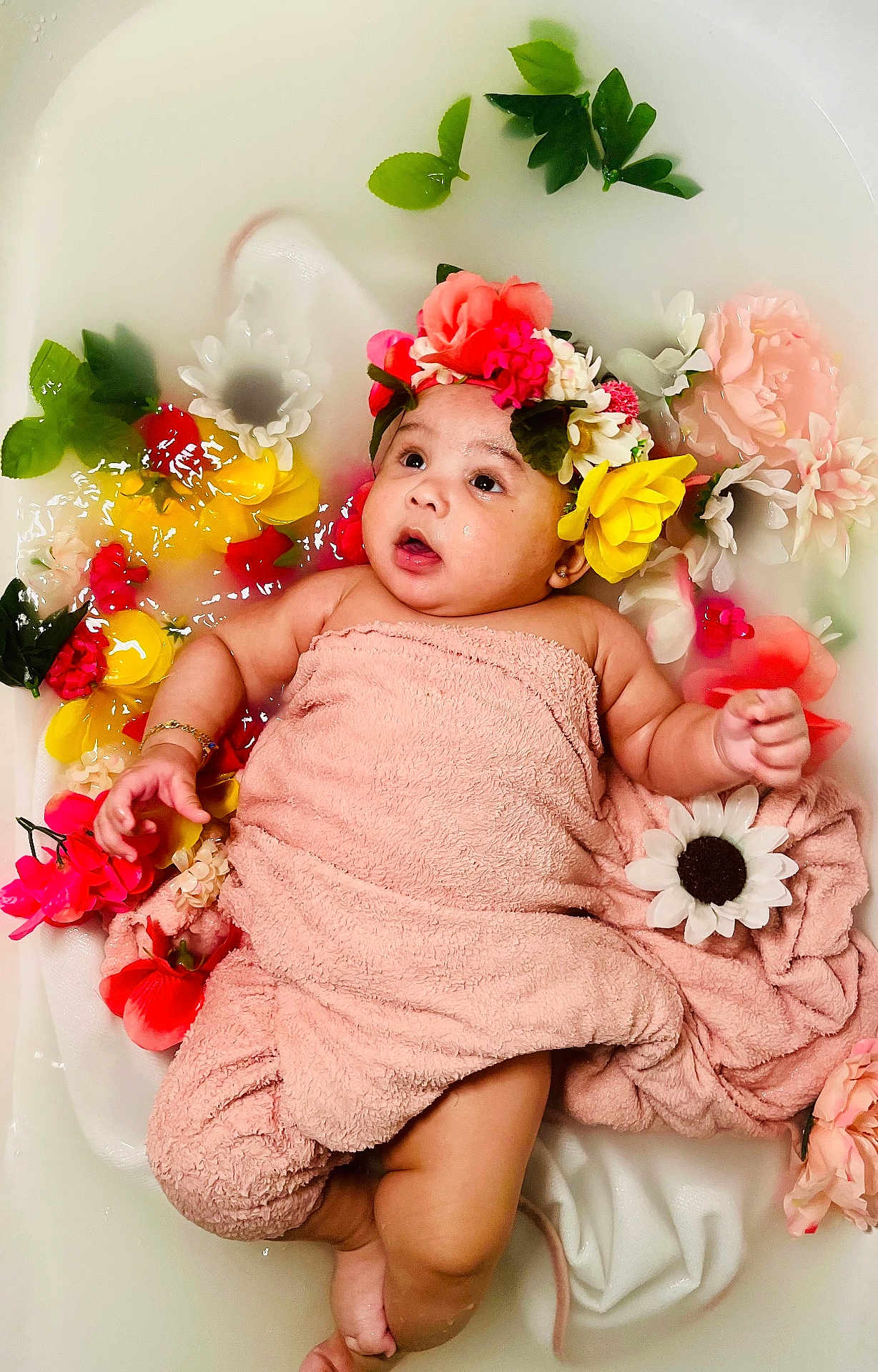 Ivelisse joined the competition — help win amazing prizes! baby, bath, child, colorful, cute, flower, flower_crown, flowers, green_leaves, headwear, infant, milky_bath, pink, portrait, relaxing, skin, soft, towel, water, yellow