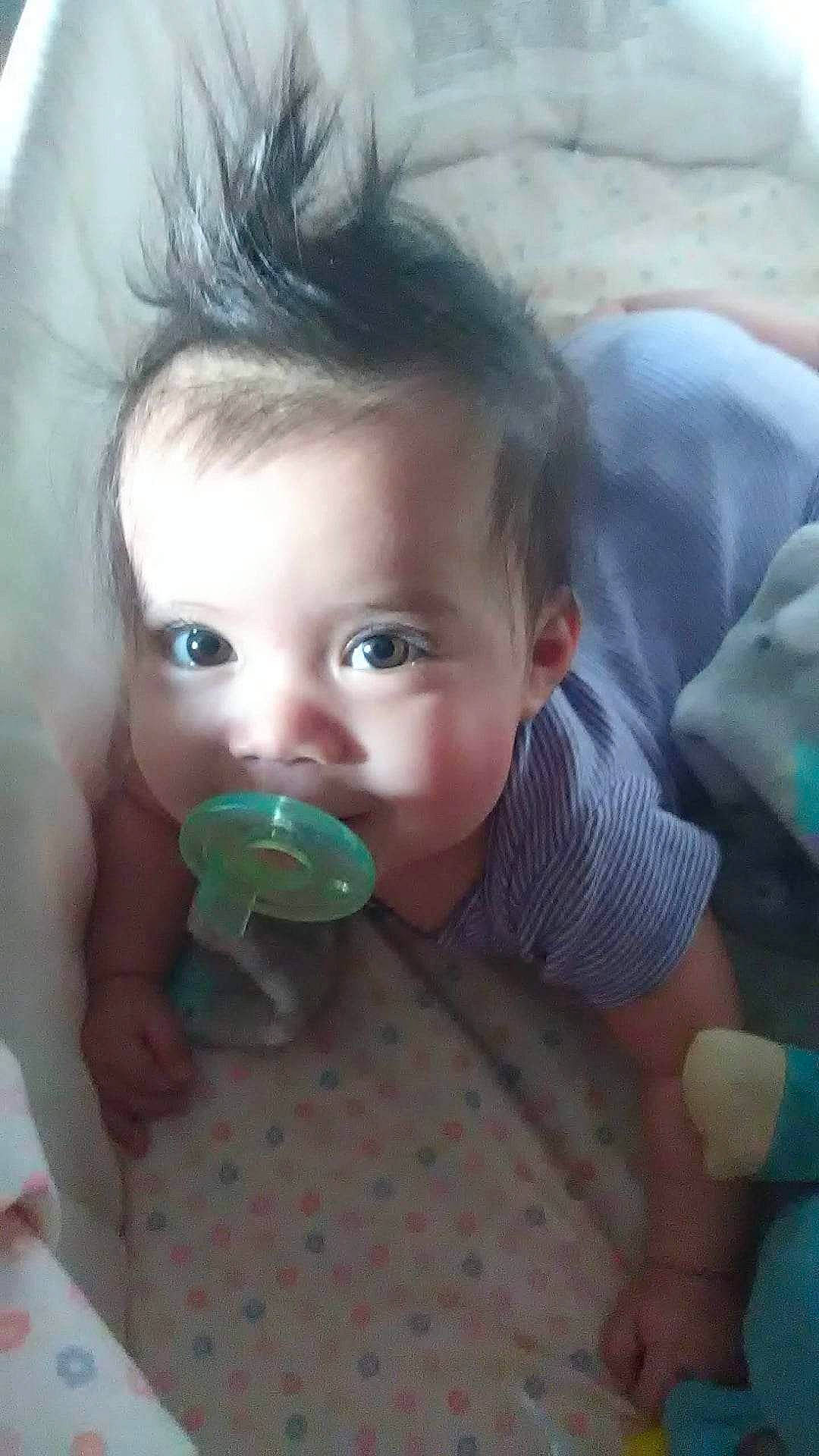 Lulu is registered to the contest to win money with this photo: baby, baby_toddler_clothing, cheek, child, eye, eyebrow, eyelash, fruit, fun, grass, hairstyle, happy, head, human_body, iris, lip, mouth, nose, person, skin