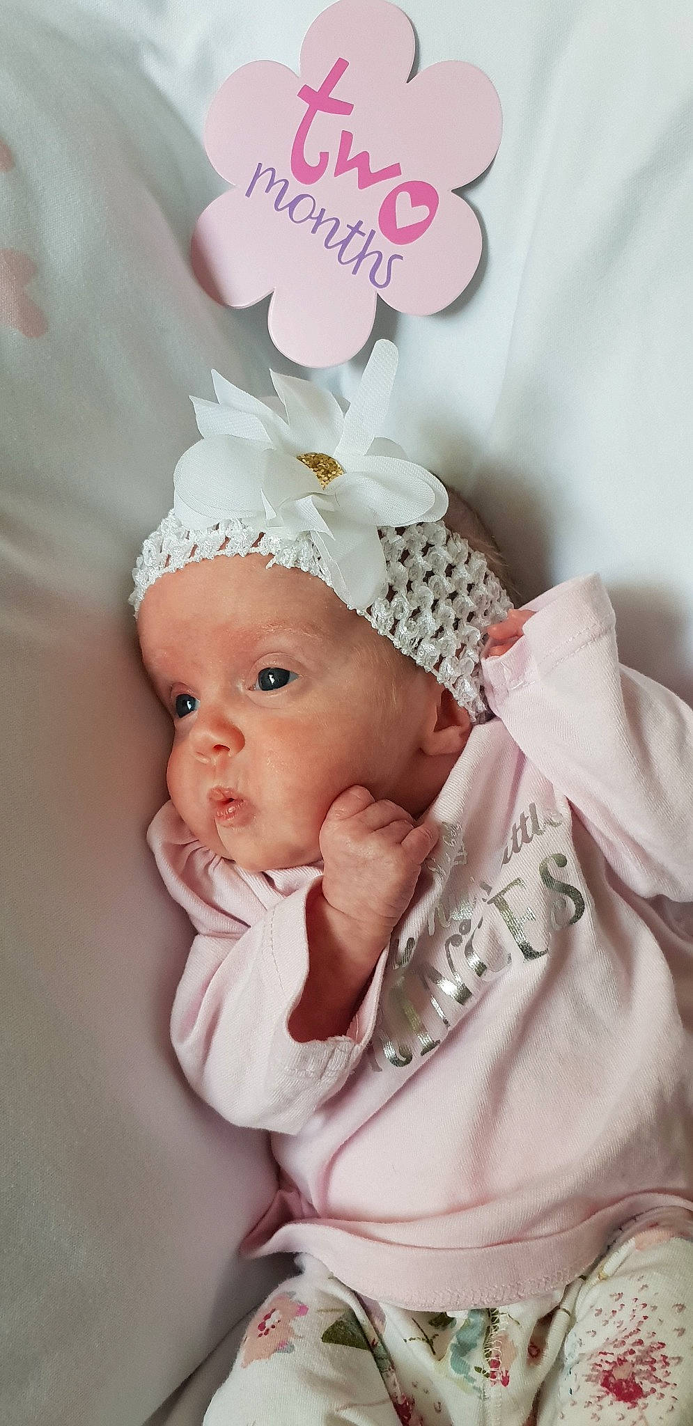 Aoife-rose is registered to the contest to win money with this photo: baby, baby_products, baby_toddler_clothing, child, fashion_accessory, hair_accessory, headgear, headpiece, headwear, pattern, person, photography, pink, product, toddler