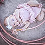 Sawyer is registered to the contest to win money with this photo: baby, baby_clothes, child, close_up, cute, dirt, flower, foot, ground, hand, headband, infant, outdoor, pink_dress, play, portrait, rope, sitting, soft_light, toddler