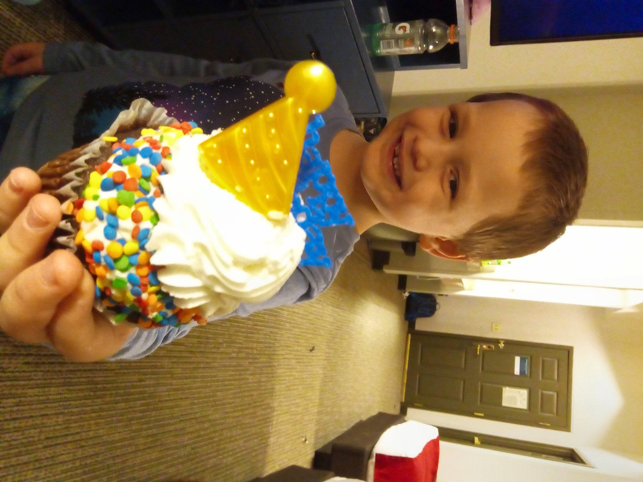 Axle is registered to the contest to win money with this photo: baked_goods, baking, buttercream, child, comfort_food, dairy, dessert, event, food, fun, ice_cream, icing, joy, party, party_supply, person, picture_frame, room, smile, sweetness