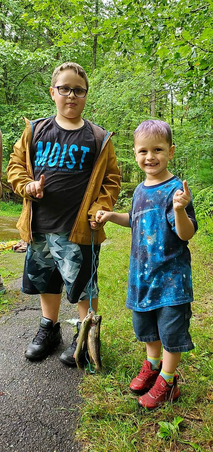 Axle is registered to the contest to win money with this photo: child, clothing, electric_blue, footwear, fun, grass, hand, happy, joy, landscape, leisure, nature, people_in_nature, person, plant, recreation, shorts, smile, sneakers, t_shirt