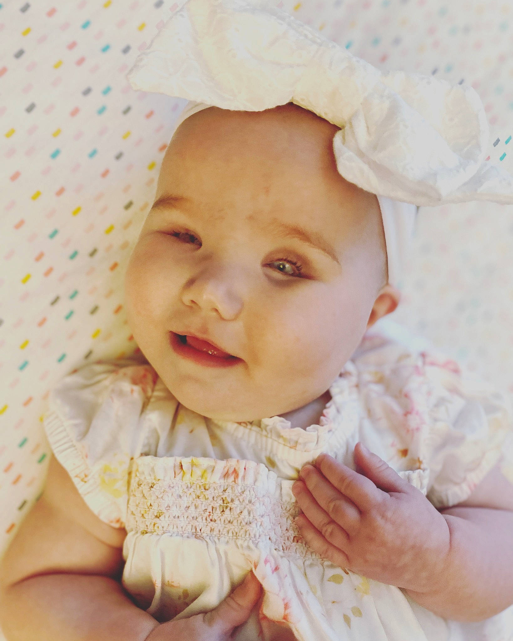 Macie is registered to the contest to win money with this photo: baby, baby_toddler_clothing, cheek, chin, dress, eye, eyebrow, eyelash, gesture, hair, happy, head, headwear, iris, lip, nose, person, pink, skin, sleeve