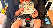 Dalton joined the competition — help win amazing prizes!  안전, baby, baseball_cap, bib, car_seat, casual_clothing, child, colorful, dinosaur_pattern, harness, indoor, infant, pacifier, photography, plush_toy, portrait, sitting, smiling, sunglasses, wood_floor