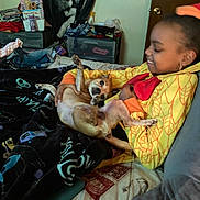 Stink joined the competition — help win amazing prizes! bed, blanket, casual, child, clothing, dog, door, drawer, fabric, face, furniture, happy, indoor, pet, portrait, relaxing, room, smile, toy, yellow_hoodie