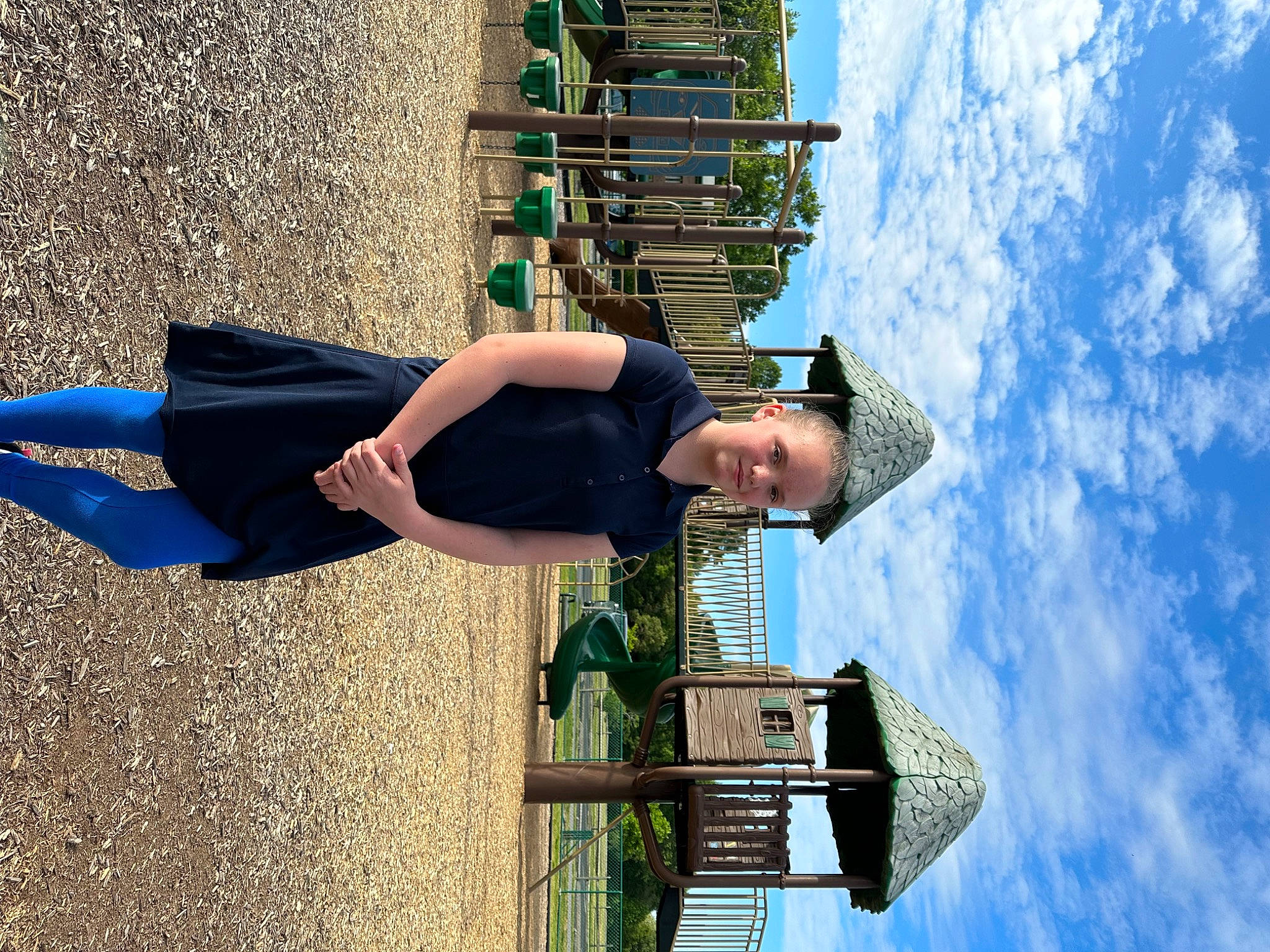 Alexis is registered to the contest to win money with this photo: arm, azure, blue, cloud, cumulus, daytime, electric_blue, eyewear, fun, green, human_leg, joy, leisure, people_in_nature, person, shadow, sky, thigh, travel, waist