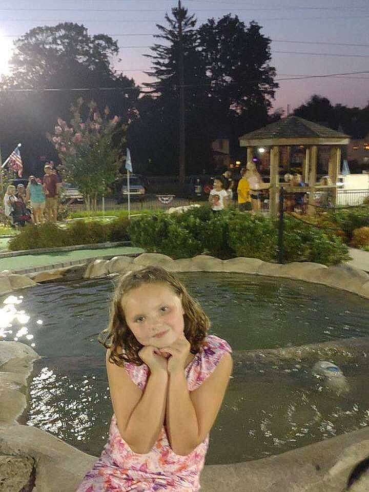 Alexis is registered to the contest to win money with this photo: bathing, child, fun, garden, grass, happy, joy, landscape, leisure, morning, person, plant, recreation, sky, summer, swimming_pool, swimwear, toddler, tourism, tree