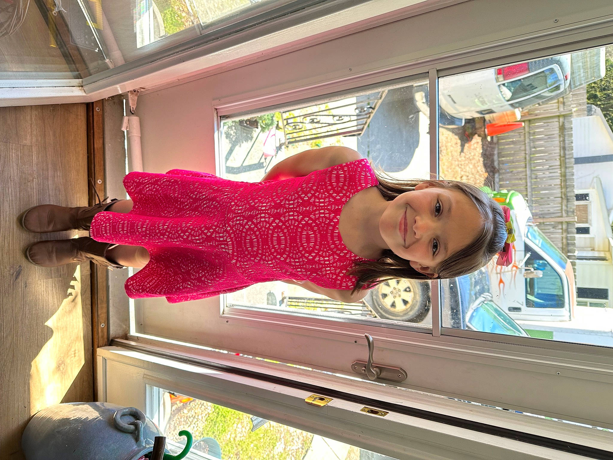 Miley is registered to the contest to win money with this photo: building, fun, joy, leisure, machine, magenta, pattern, person, room, toddler, travel, vacation, window, wood