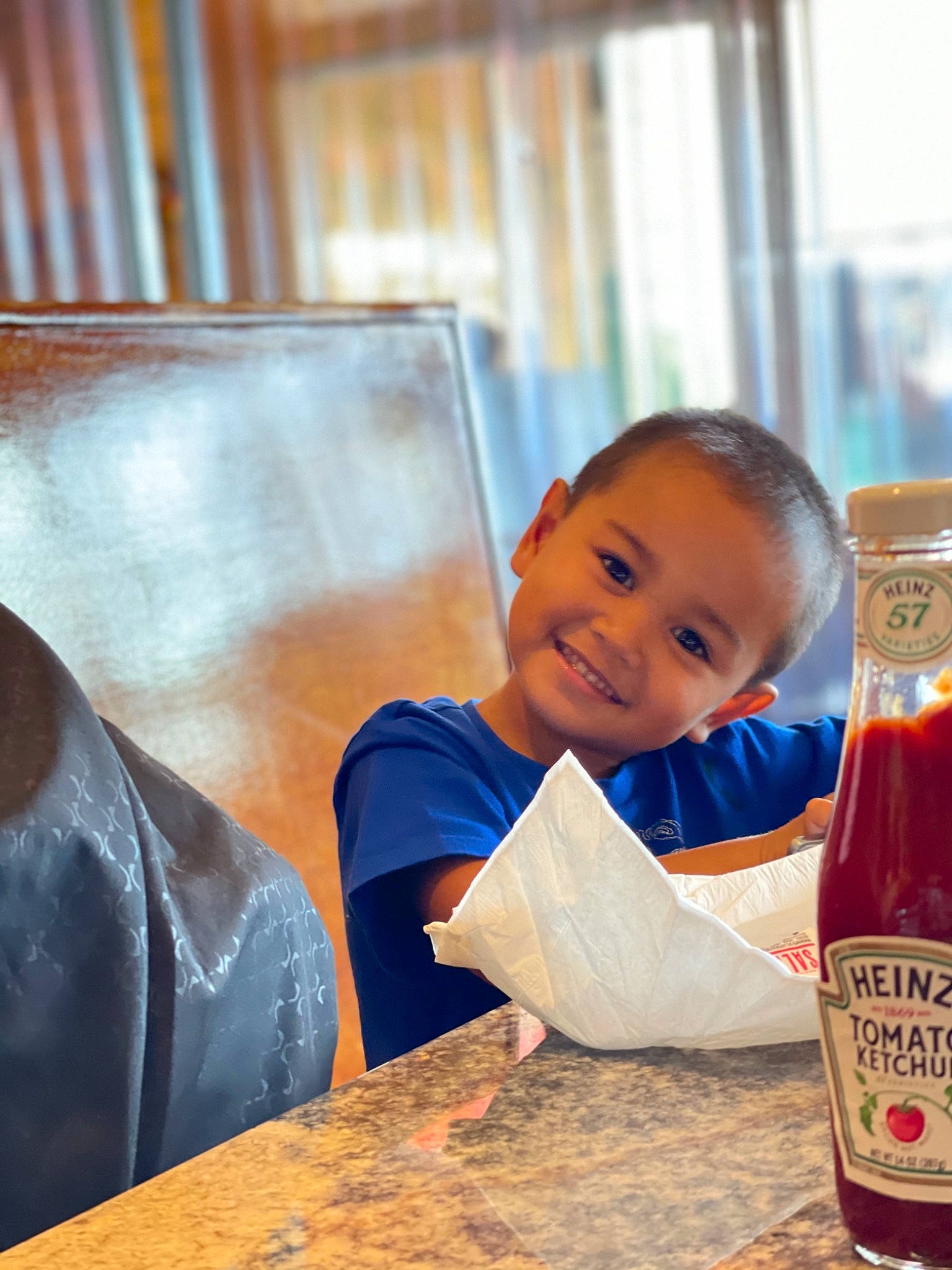 Casen joined the competition — help win amazing prizes! baby, bottle, child, drink, flooring, food, fun, glass_bottle, happy, ingredient, joy, leisure, liqueur, person, portrait_photography, room, sitting, smile, table, toddler