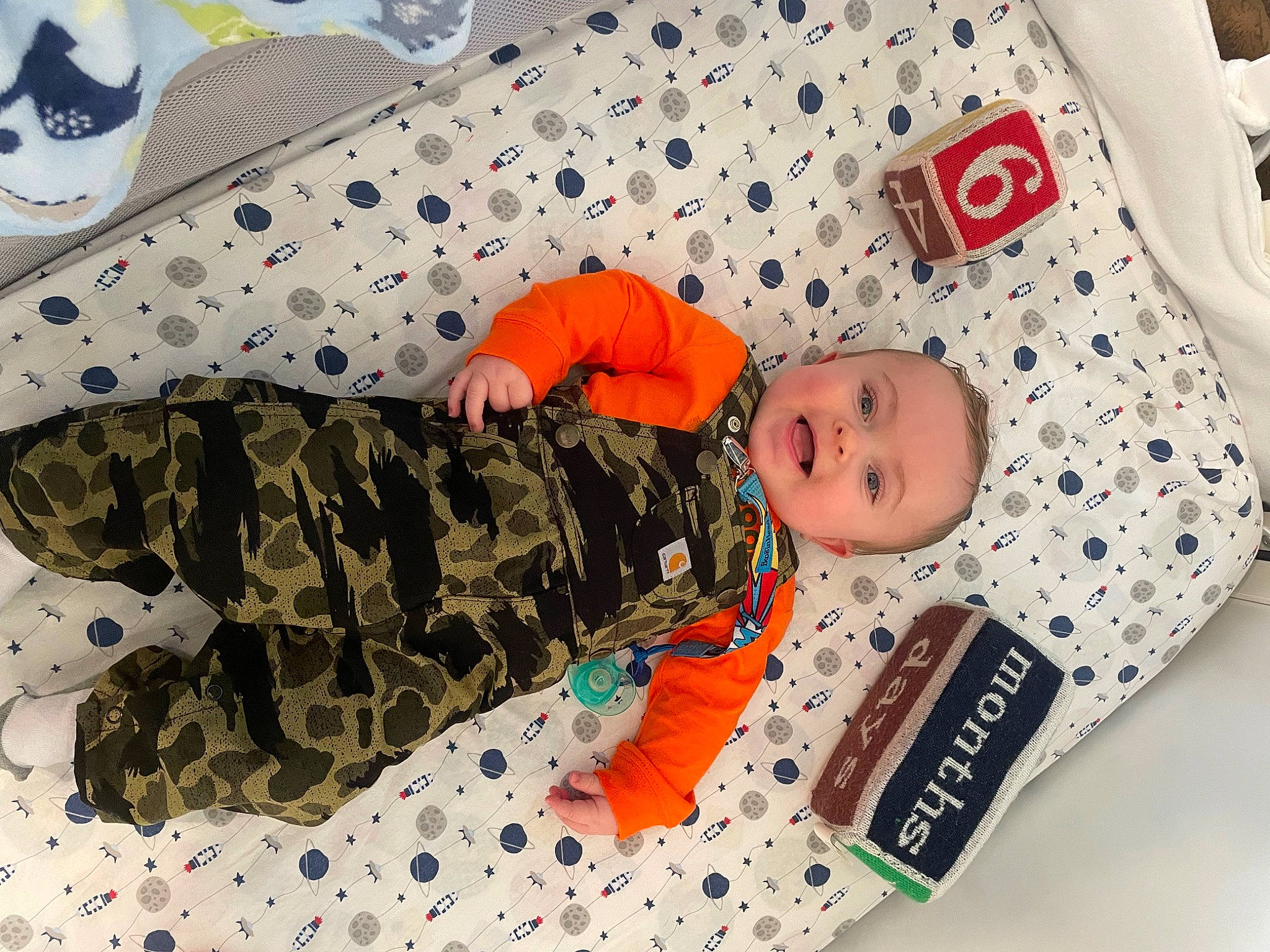 Colton joined the competition — help win amazing prizes! baby, baby_products, baby_toddler_clothing, camouflage, cargo_pants, child, comfort, linens, mammal, military, military_camouflage, military_person, military_uniform, pattern, people, person, sleeve, smile, soldier, textile