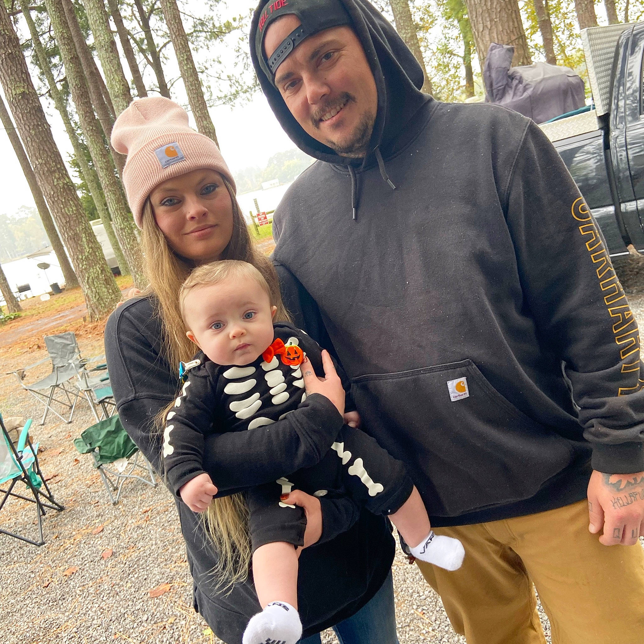 Colton is registered to the contest to win money with this photo: baby, baby_products, cap, child, cool, event, face, facial_expression, friendship, fun, happy, headwear, interaction, joy, lap, people, person, sitting, sleeve, smile