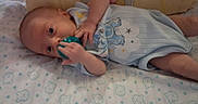 Noah joined the competition — help win amazing prizes! baby, blanket, blue_outfit, child, comfort, cozy, cushion, cute, elephant_design, indoor, infant, lying_down, newborn, pacifier, patterned_blanket, portrait, resting, sleeping_area, small_hands, soft_lighting